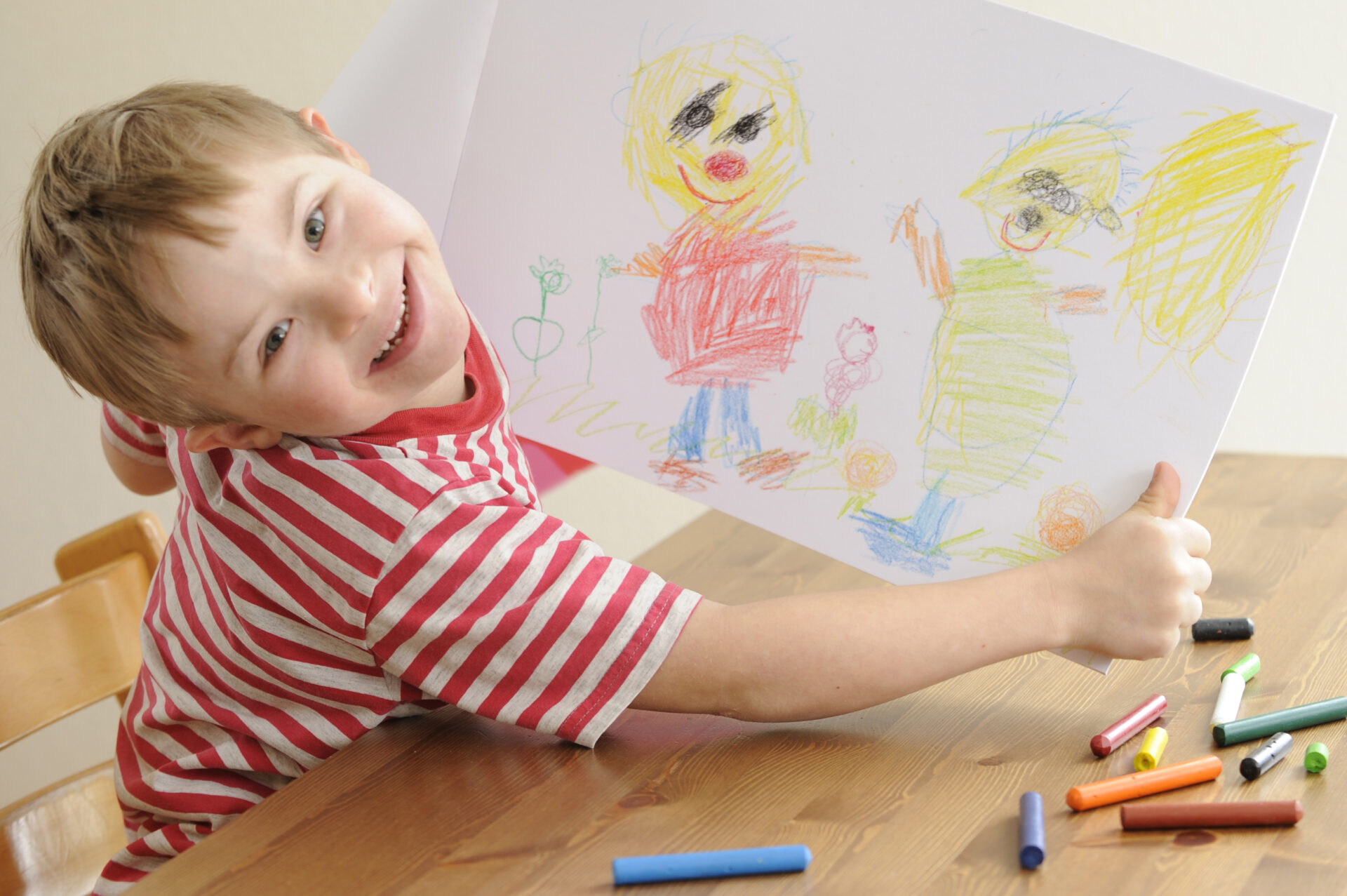 Seven year old boy with Down Syndrome shows his drawing. More photo's of this boy: