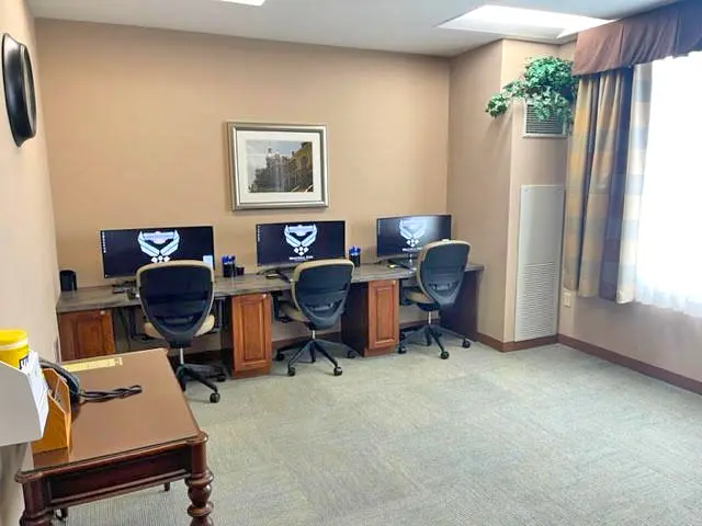 three chairs and desktops in the office